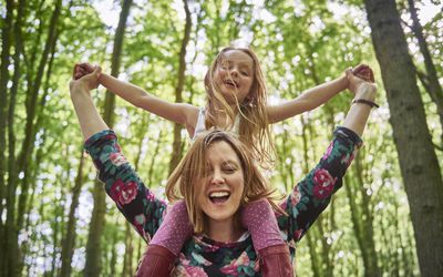 Woman with daughter on her shoulders