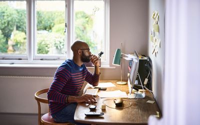 Man working at home on computer